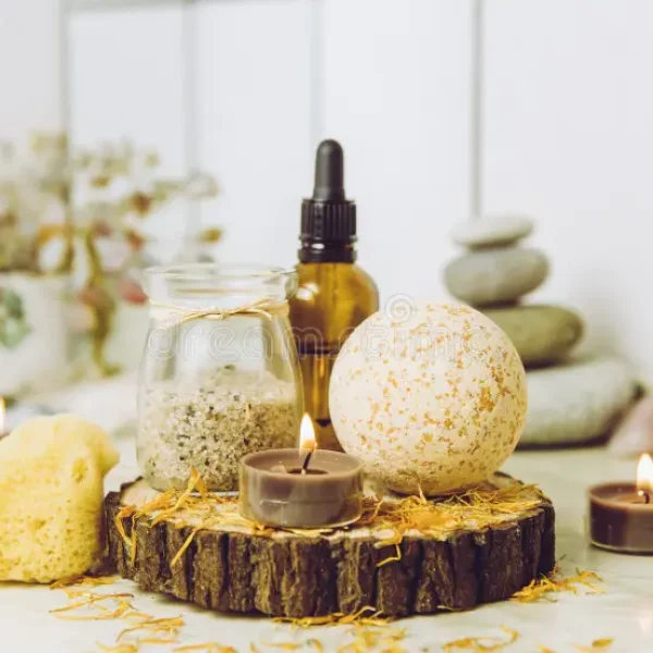 side-view-home-wellness-spa-products-orange-bath-bomb-aroma-bath-salt-sea-sponge-tea-candles-lit-side-view-home-wellness-spa-176384800